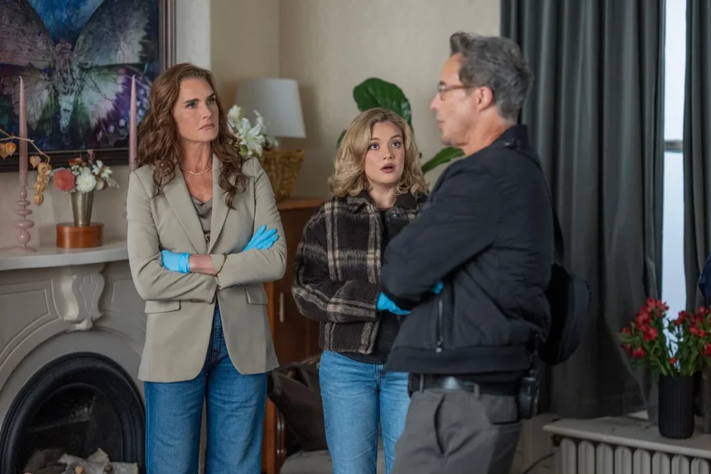 Brooke Shields as Allie, Amalia Williamson as Andi, and Tom Cavanagh as detective Jack in a scene from You're Killing Me on Acorn TV.