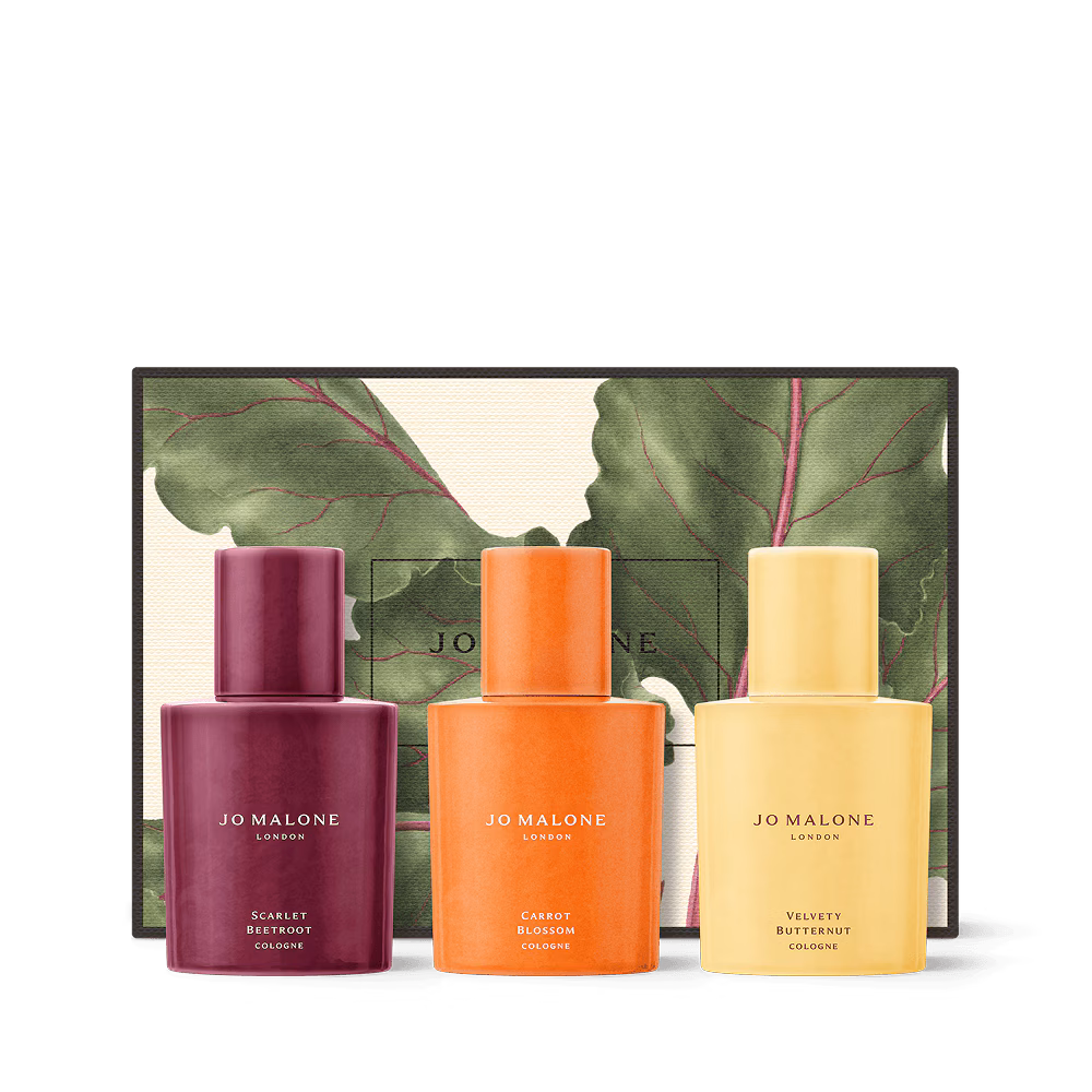 Three bottles of luxury Jo Malone London colognes displayed in front of a leaf-motif gift box.