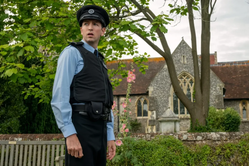 Actor Nicholas Braun as a local police officer in The Sheep Detectives movie.