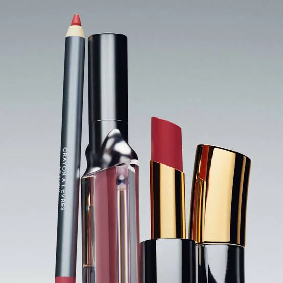 Byredo makeup products including a red lipstick, pink lip gloss and lip pencil