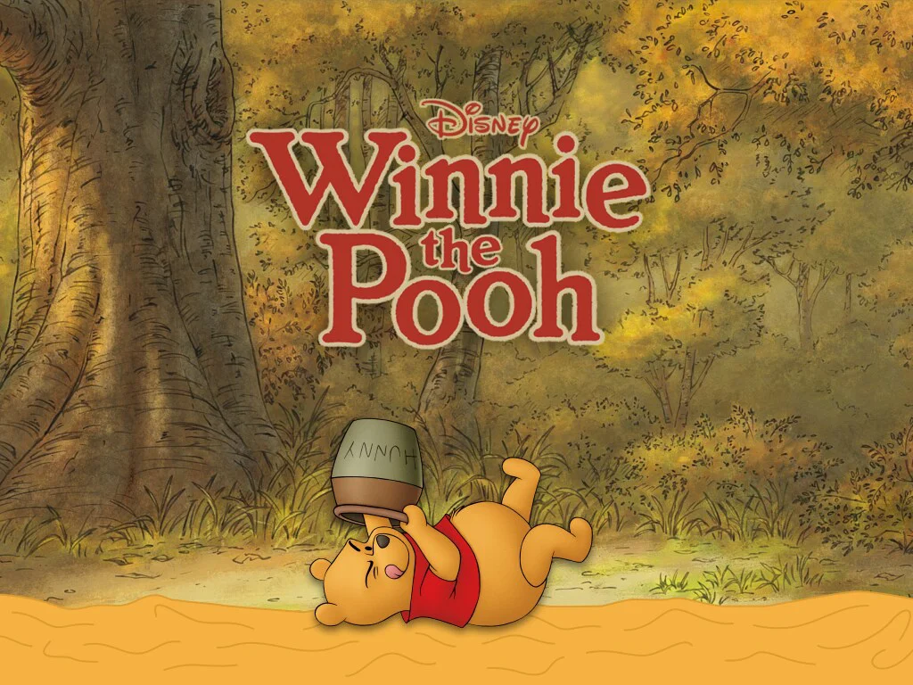 Disney's Winnie the Pooh rests with his honey pot beneath the red Winnie the Pooh title against an illustrated forest.